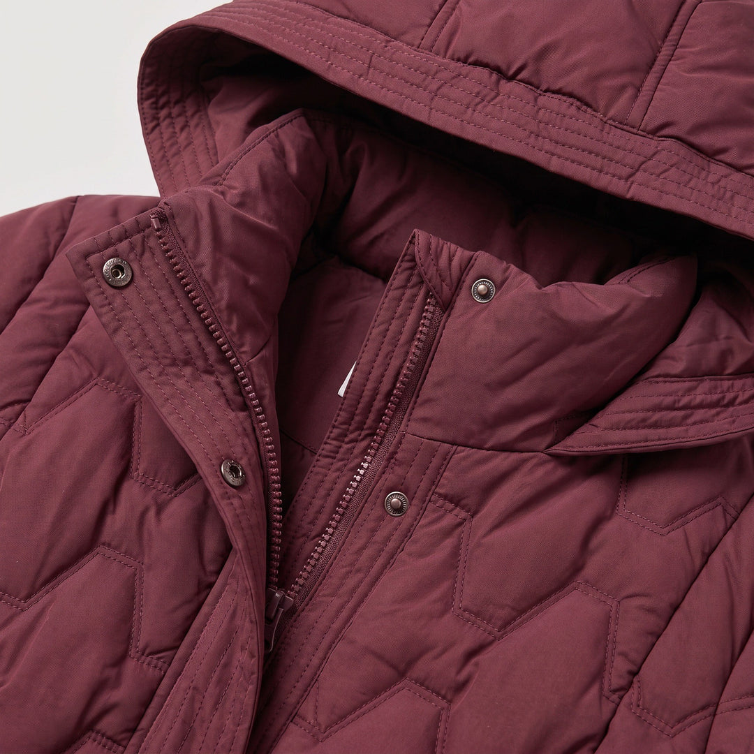 Sina — Gesteppter wattierter Daunenmantel für Damen mit grosser Kapuze, Das Modehaus Luzern